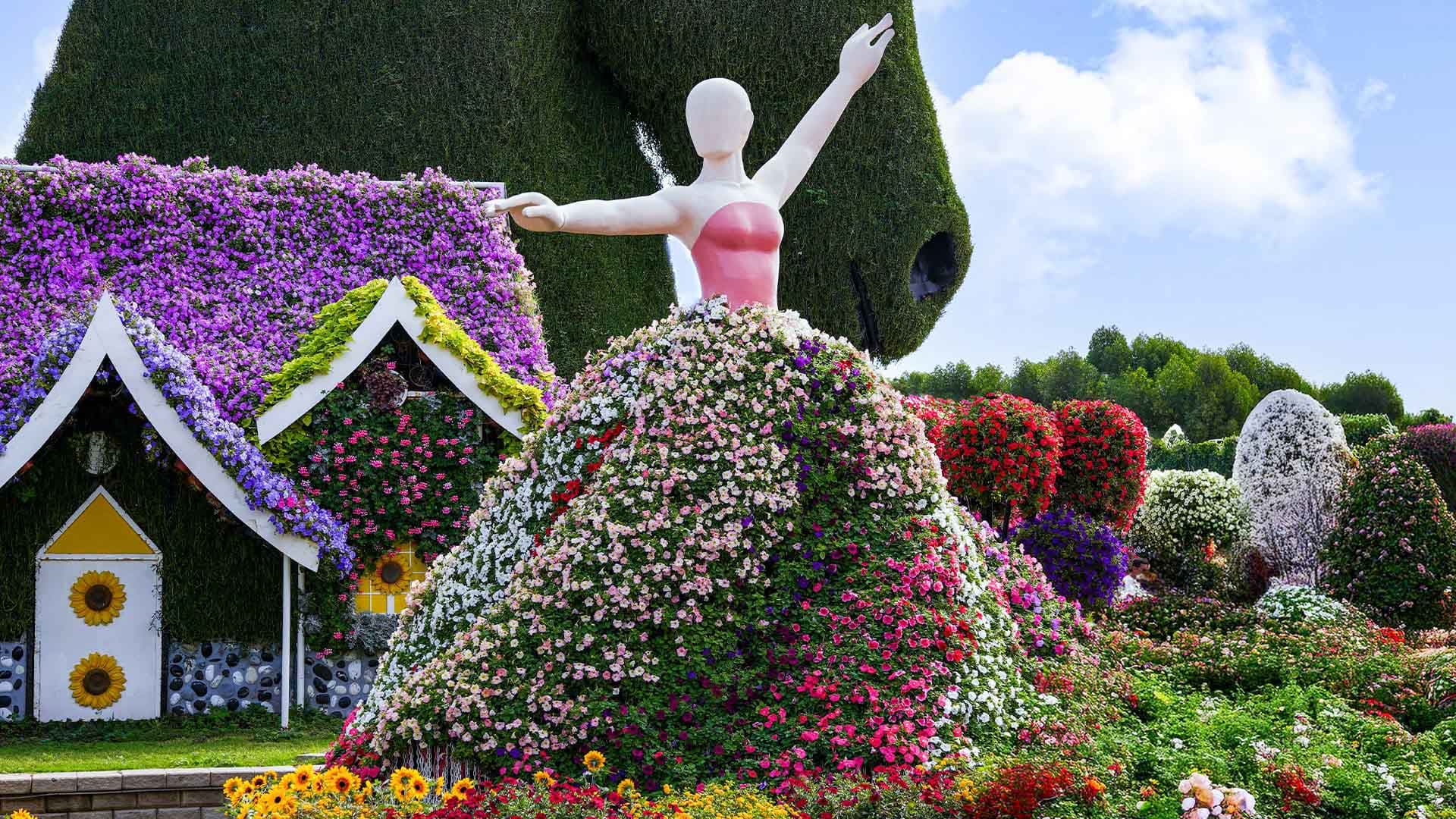 The Floating Lady sculpture covered in flowers at Dubai Miracle Garden